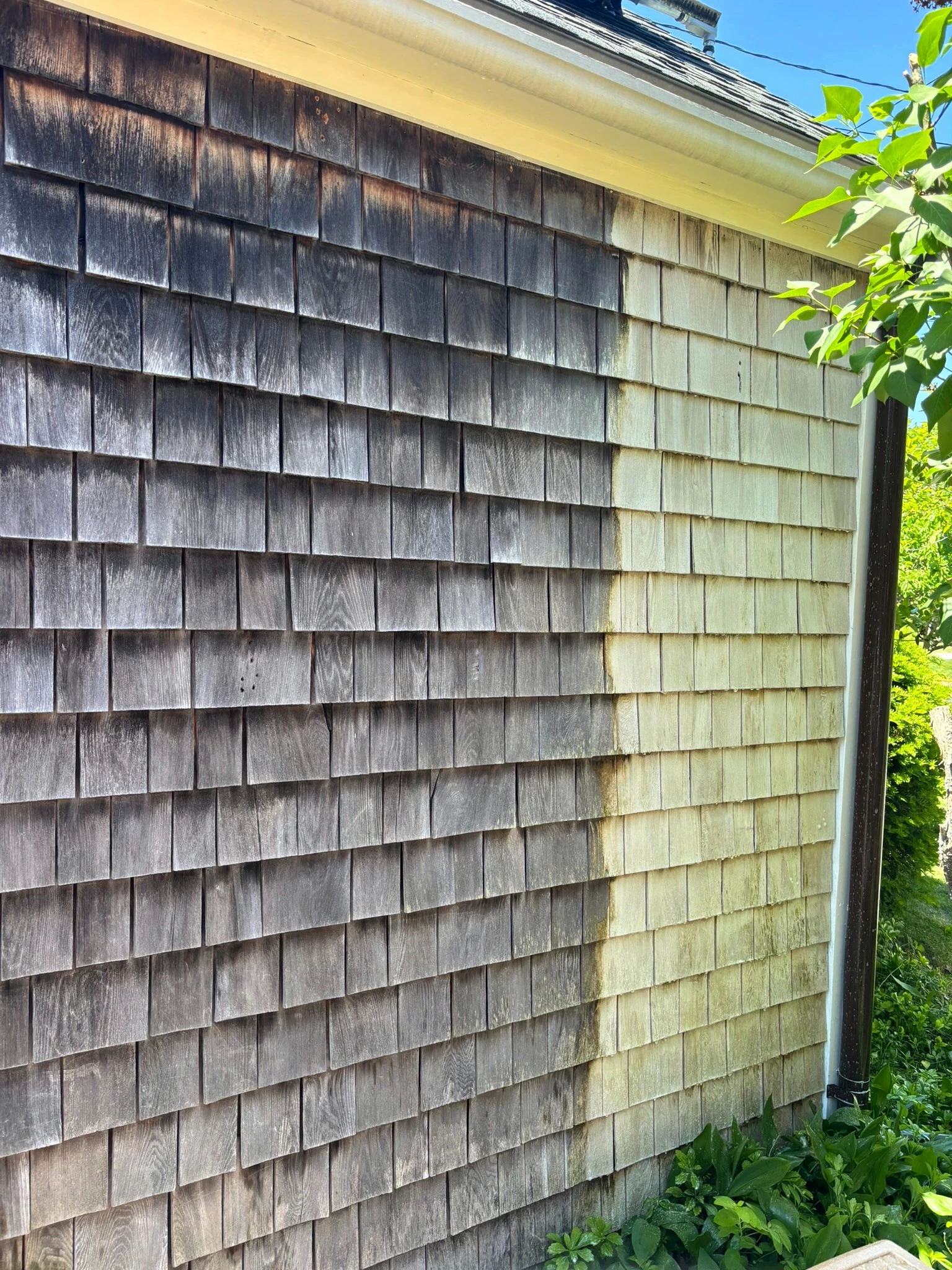 Close view of weathered cedar shingles during a Slate Hill Restoration project